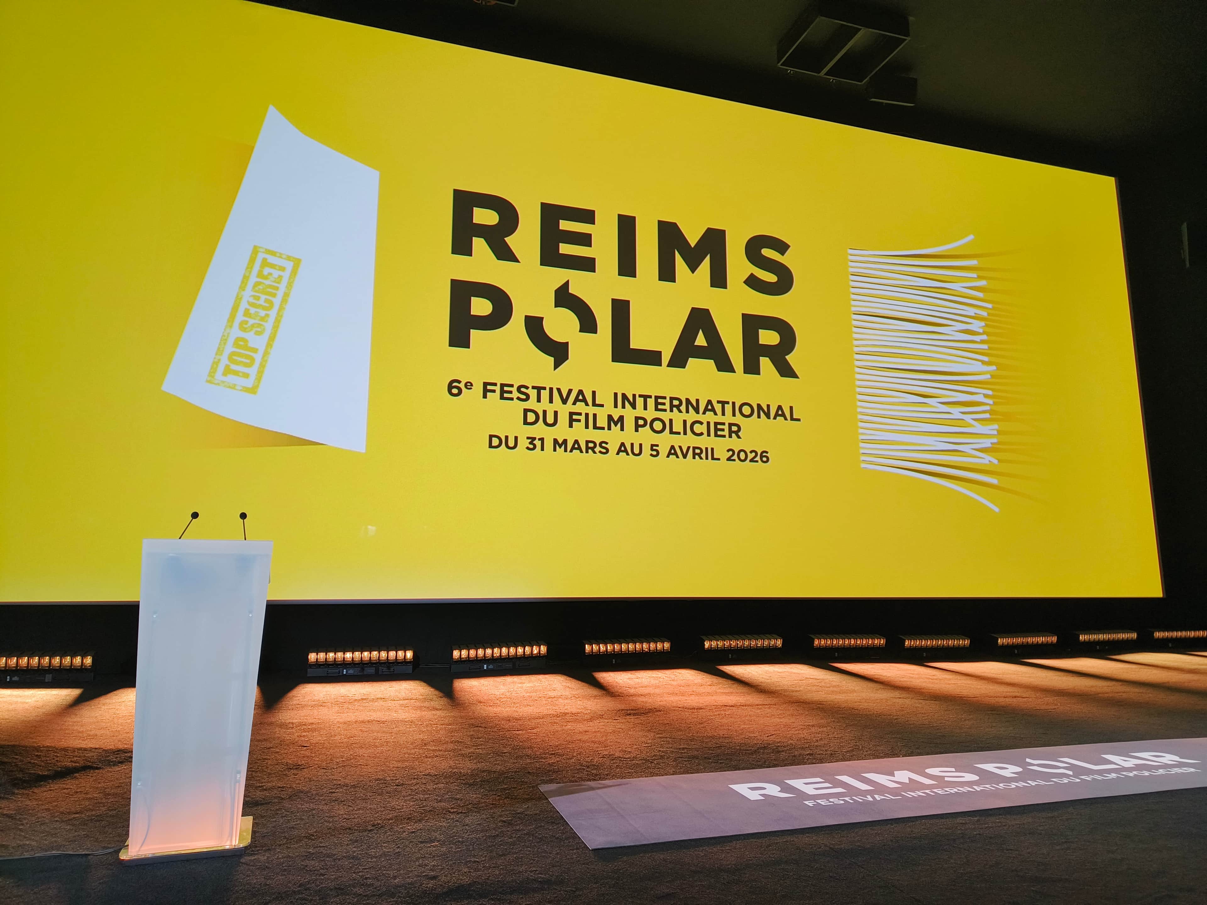 Affiche de « REIMS POLAR » avec un écran jaune annonçant le 6e Festival international du film policier.