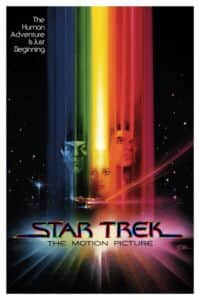 Affiche de « STAR TREK THE MOTION PICTURE » avec des visages dans des rayons colorés.